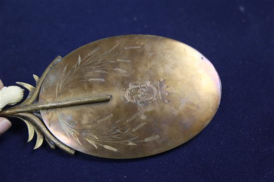 A 19th century French ormolu hand mirror, 12.25in.